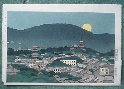 Okumura Koichi: a town as the moon is rising over the mountains - Japanese Art Open Database