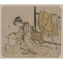 Unknown: Young lady removing a kemari (ball) from its box. - Library of Congress