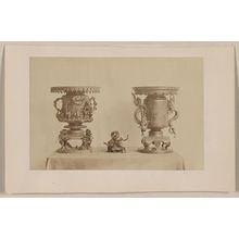 Unknown: [Tall, metal, ornate plant stands and figurine, all with dragon motif, on a table] - Library of Congress