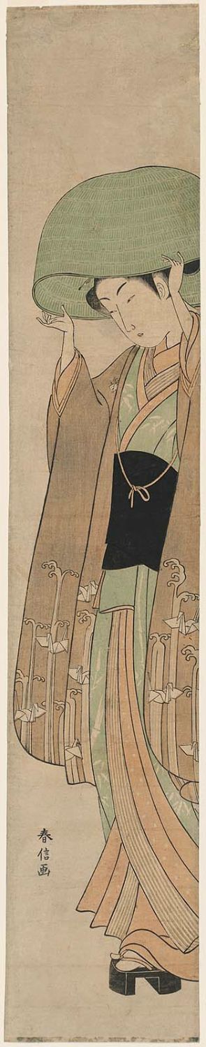 Suzuki Harunobu: Woman Putting on a Large Basket Hat - Museum of Fine Arts